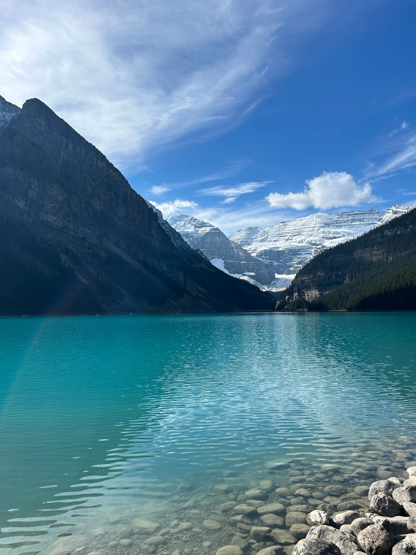 Emerald-green Lake Louise seen from high on the Little Beehive, mountains framing the water below