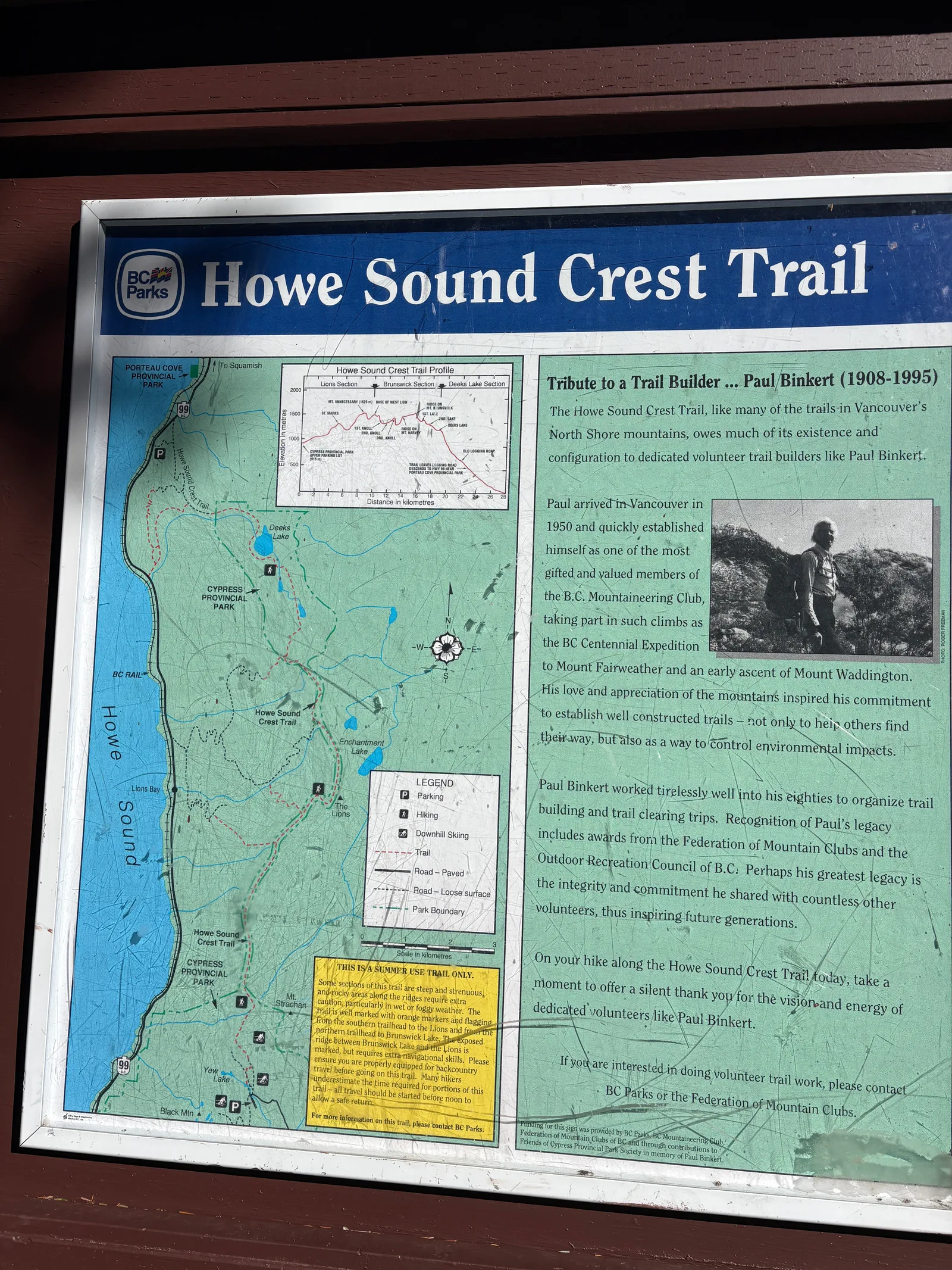 Interpretive signboard for the Howe Sound Crest Trail at the Cypress trailhead, showing a trail map and elevation profile